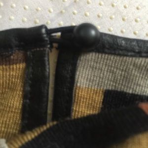 Long sleeved wool with pleather trim